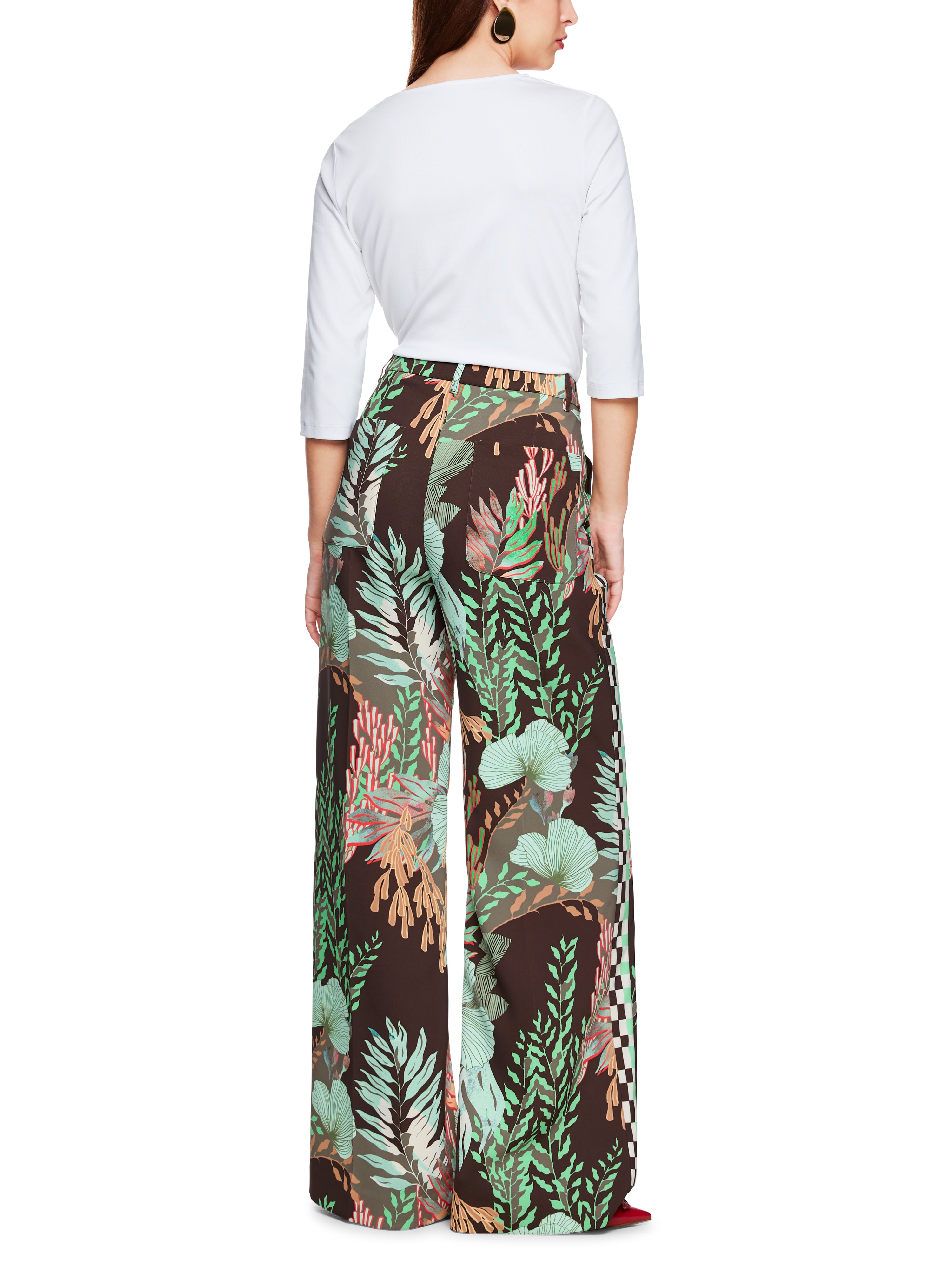 מכנסיים מתרחבים בגזרה גבוהה עם הדפס פרחוניהרכב: 97% פוליאסטר, 3% אלסטןהדוגמנית בגובה 1.79 ולובשת מידה 3 של מארק קיין