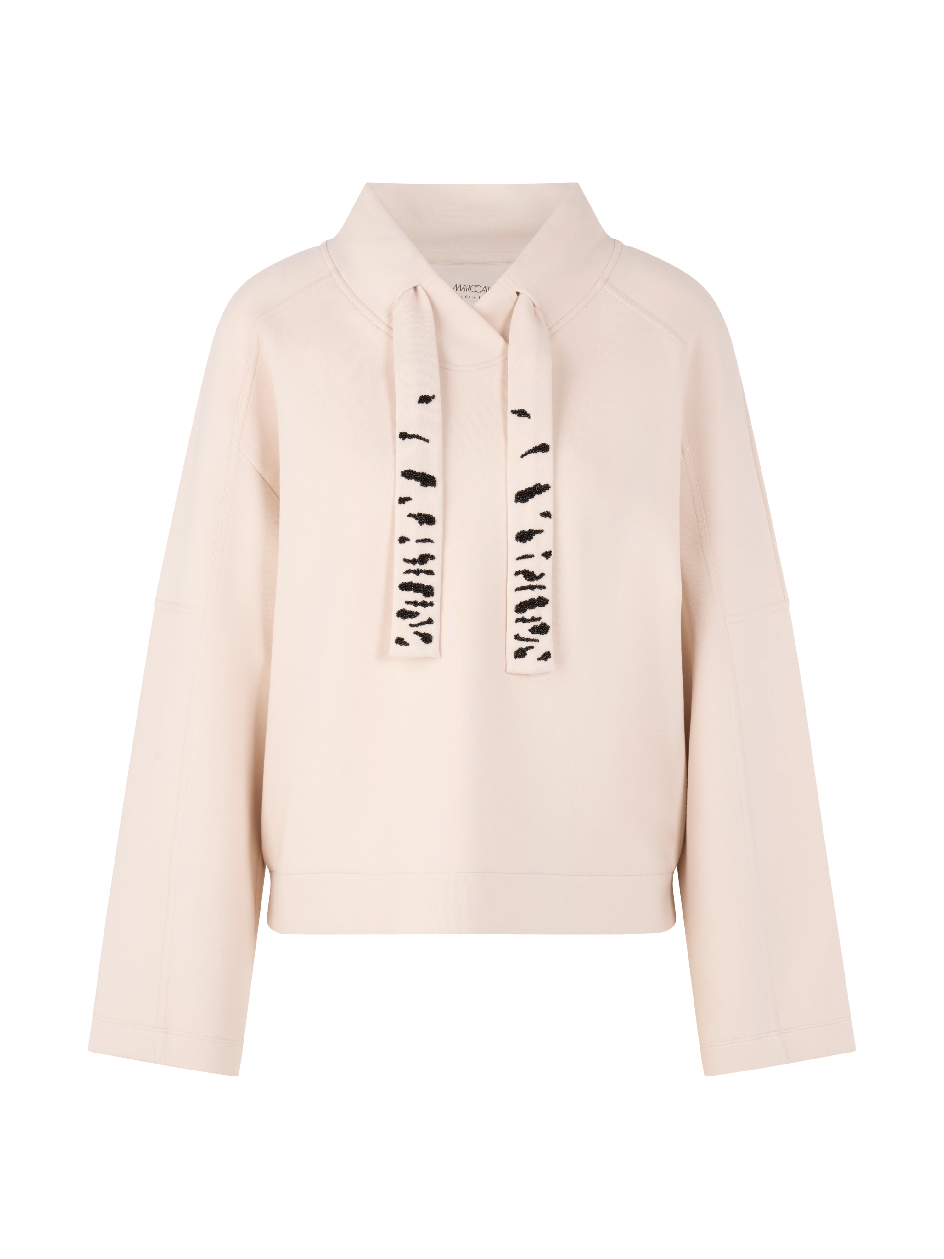 סווטשירט בגזרה רחבה עם שרוולים רחביםהרכב: 88% כותנה, 8% פוליאסטר, 4% אלסטןהדוגמנית בגובה 1.79 ולובשת מידה 3 של מארק קיין