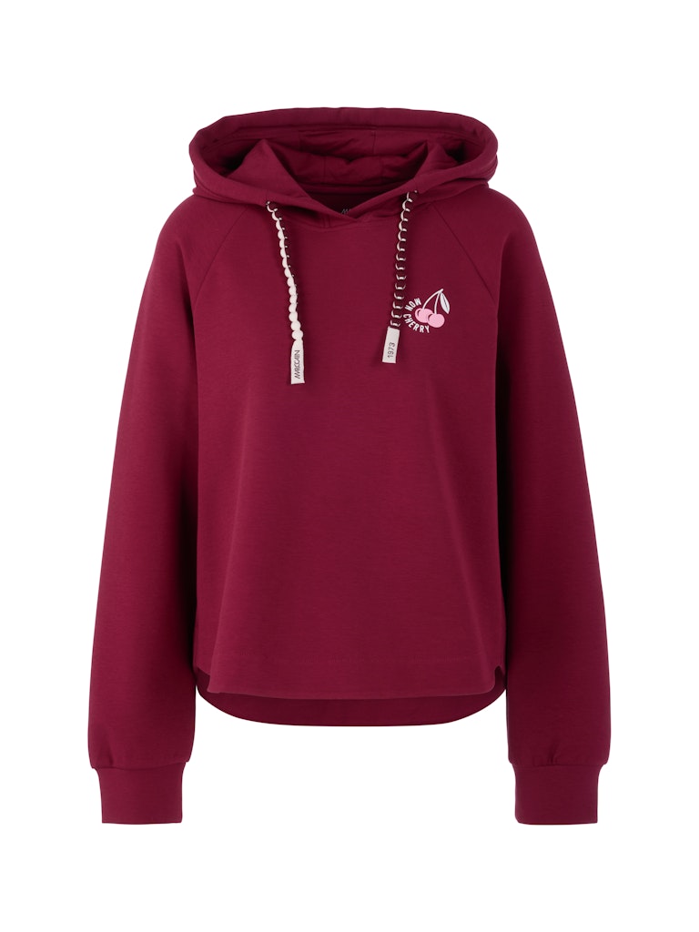 סווטשירט בגזרה רחבה ונינוחה מבד רך ונעים, עם כובע קפוצ'ון ושרוכי קשירה.הדפס MON CHERRY בגב, בשילוב אבני חן.הרכב: 88% כותנה, 8% פוליאסטר, 4% אלסטן.הדוגמנית בגובה 1.79 ולובשת מידה 3 של מארק קיין