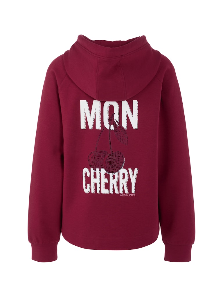 סווטשירט בגזרה רחבה ונינוחה מבד רך ונעים, עם כובע קפוצ'ון ושרוכי קשירה.הדפס MON CHERRY בגב, בשילוב אבני חן.הרכב: 88% כותנה, 8% פוליאסטר, 4% אלסטן.הדוגמנית בגובה 1.79 ולובשת מידה 3 של מארק קיין