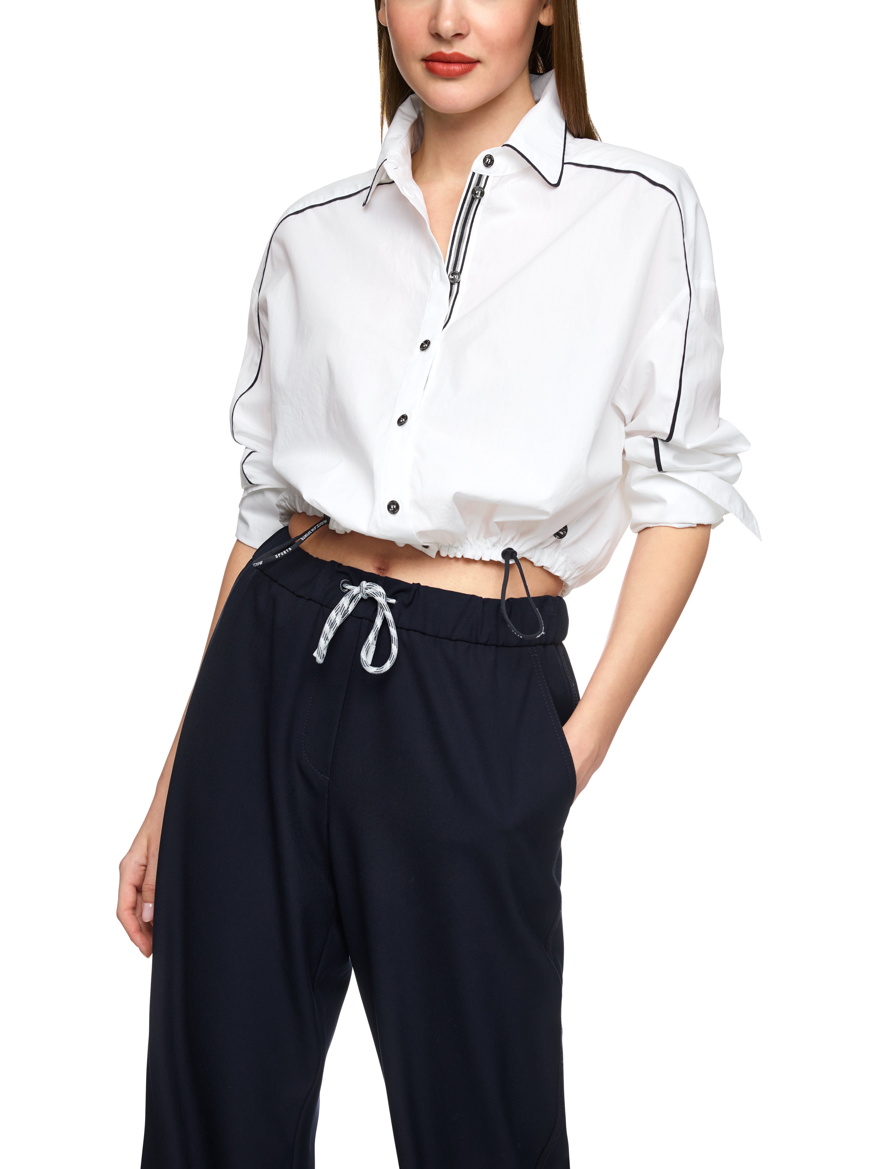 חולצה קצרה עשויה כותנה עם גומייה מתכווננת במכפלת אלסטיתהרכב: 100% כותנההדוגמנית בגובה 1.79 ולובשת מידה 3 של מארק קיין