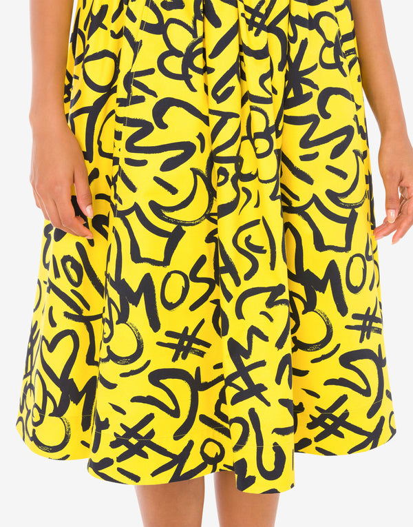 חצאית כותנה בגזרת A ליין צהובה עם פרינט שרבוטים בשחור