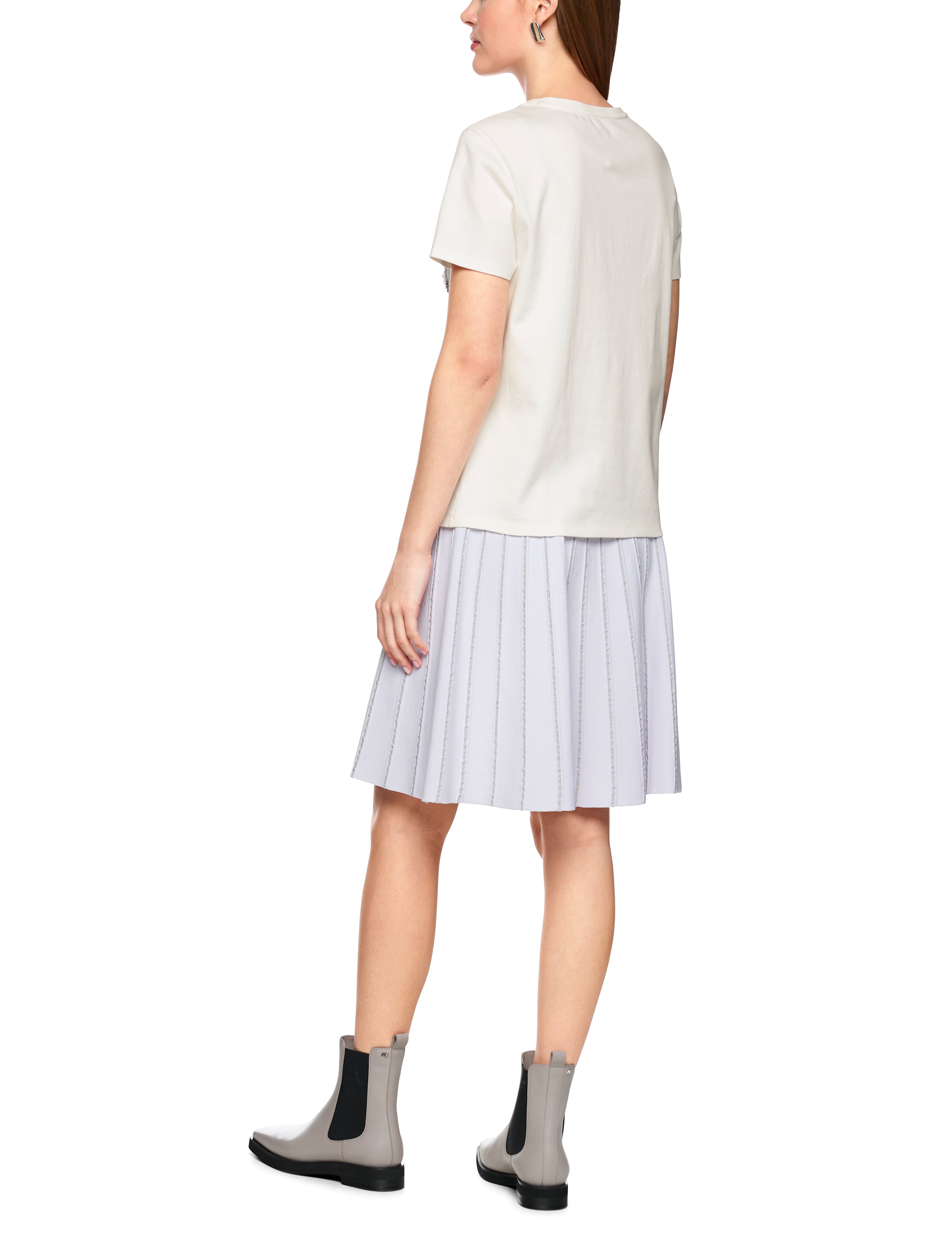 חולצת טי עשויה כותנה עם הדפסהרכב: 100% כותנההדוגמנית בגובה 1.79 ולובשת מידה 3 של מארק קיין