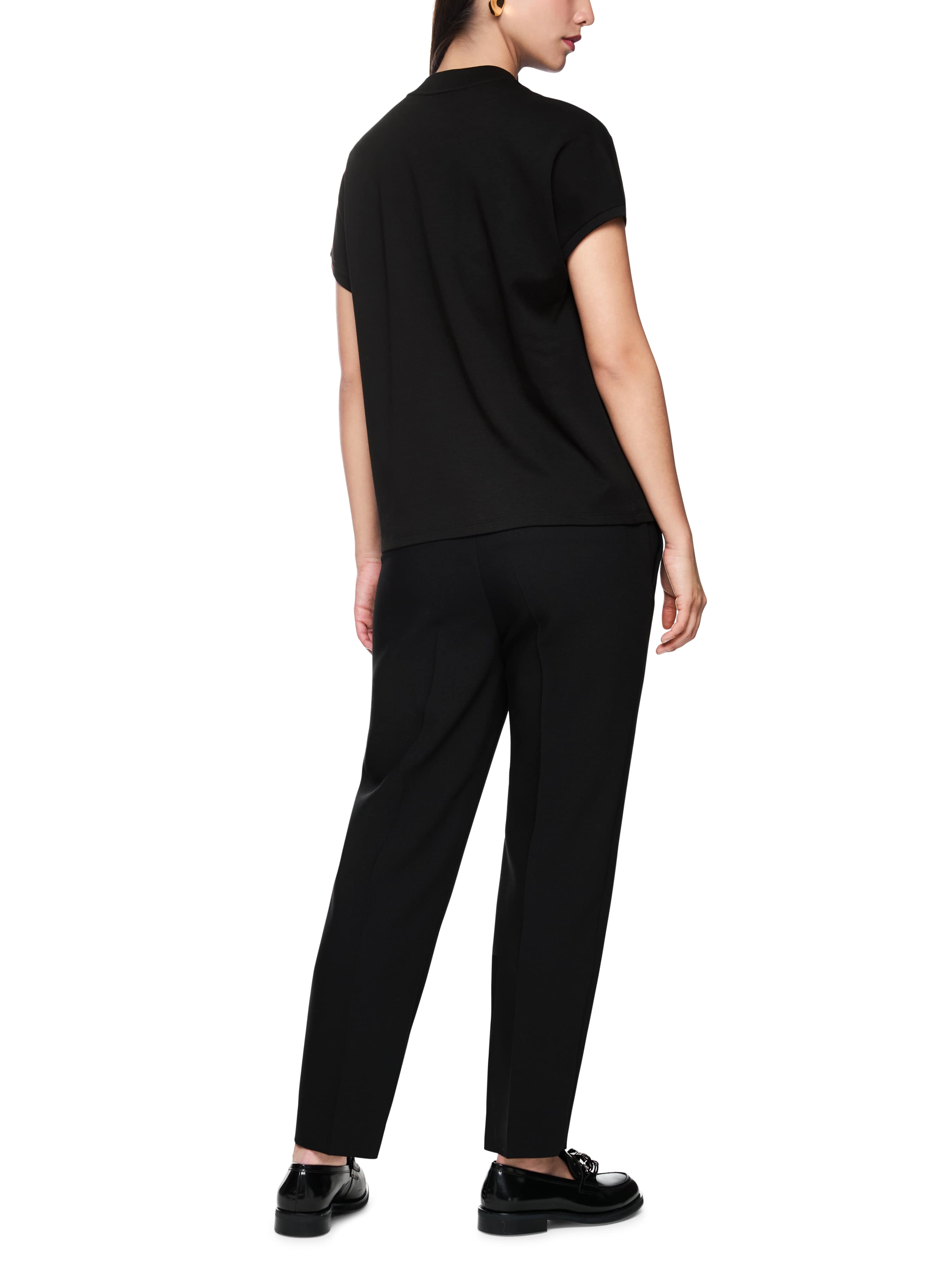 חולצת טי עשויה כותנה עם הדפסהרכב: 100% כותנההדוגמנית בגובה 1.79 ולובשת מידה 3 של מארק קיין