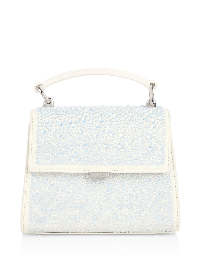 תיק יד אלגנטי עשוי עור, מעוטר אבני קריסטל מנצנצות. עם ידית אחיזה, סגירה מגנטית, ורצועת כתף נשלפת ומתכווננת למגוון אפשרויות נשיאה.מידות: 17*9*14 ס"מהרכב: 100% עור