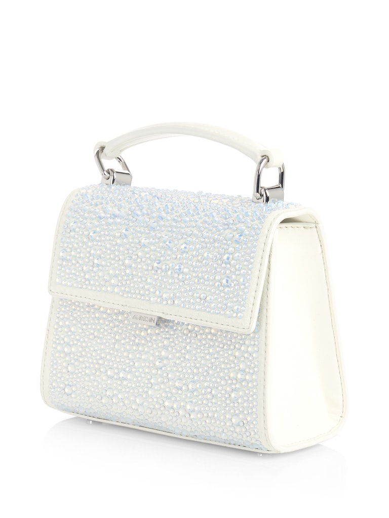 תיק יד אלגנטי עשוי עור, מעוטר אבני קריסטל מנצנצות. עם ידית אחיזה, סגירה מגנטית, ורצועת כתף נשלפת ומתכווננת למגוון אפשרויות נשיאה.מידות: 17*9*14 ס"מהרכב: 100% עור