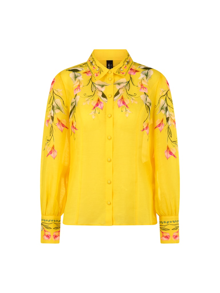 חולצה מכופתרת קלילה ואלגנטית, עשויה תערובת פשתן ומשי איכותית ונעימה. גזרה נשית ונינוחה, עם צווארון קלאסי, שרוולים ארוכים בסיומת חפתים רחבים מכופתרים, וסגירה באמצעות שורת כפתורים קדמית. הדפס צבעוני של דוגמת פרחי קאלה המעטר את החלק העליון של החולצה, הצווארון, והחפתים, מדגיש את העיצוב הייחודי.הרכב: 55% פשתן, 45% משיהדוגמנית בגובה 1.79 ולובשת מידה 3 של מארק קיין