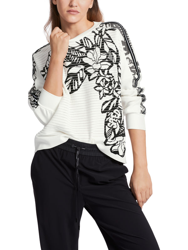 סוודר משילוב בדים בצבע לבן עם פרינט פרחים בשחור צווארון עגול