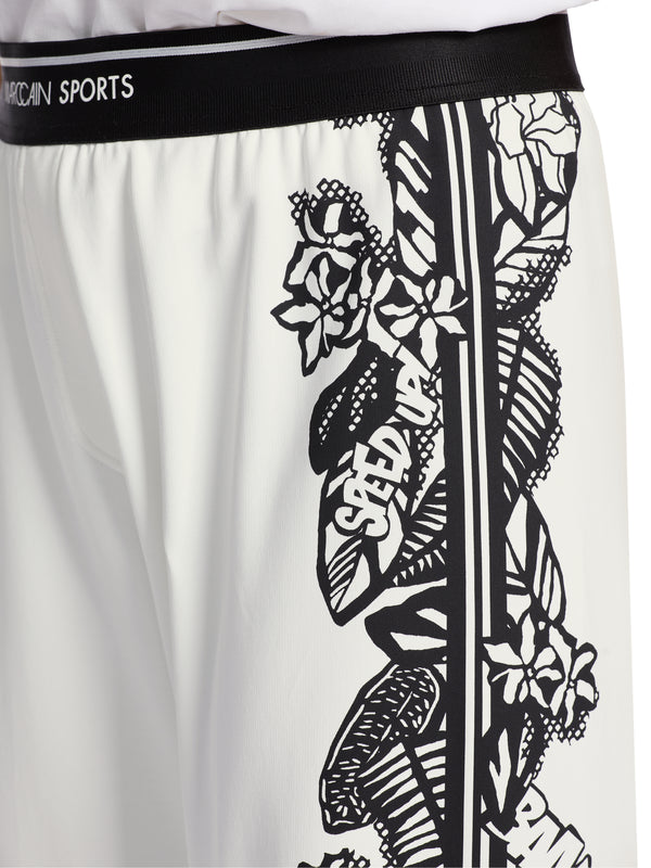 מכנסי לאונג' דגם WELBY רגל רחבה בצבע לבן עם פרינט פרחים שחורים בצדדים