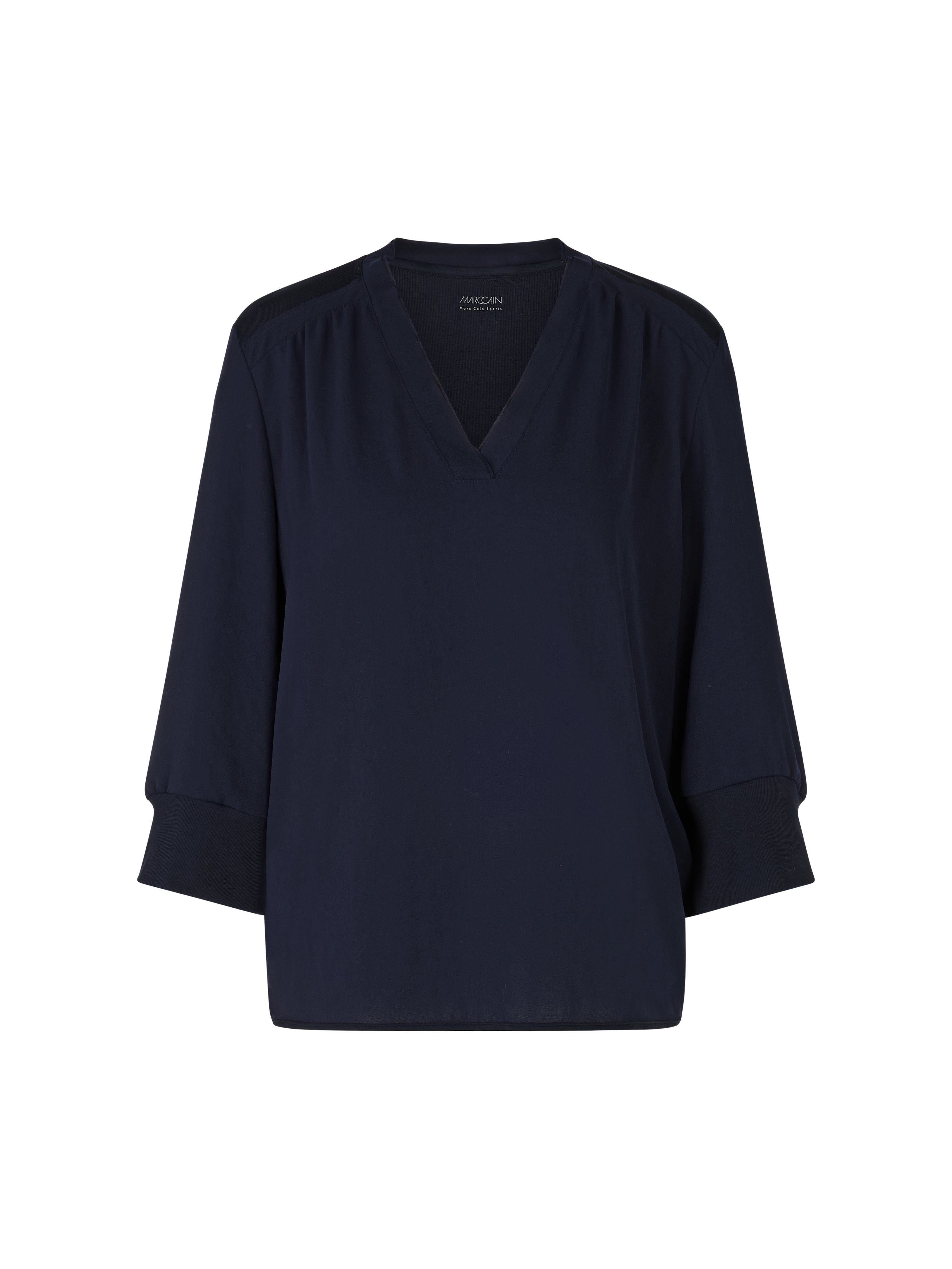 חולצה בגזרה זורמת עם צווארון V הרכב: 100% פוליאסטרהדוגמנית בגובה 1.79 ולובשת מידה 3 של מארק קיין