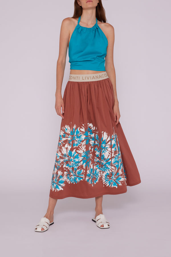 חצאית מידי בצבע חמרה עם הדפס פרחים בתכלת גומי במותן